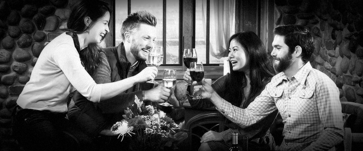 Couples Toasting in 2Hawk Vineyard and Winery Tasting Room (Grayscale)
