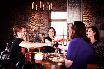 Ladies Toasting in 2Hawk Vineyard and Winery Tasting Room