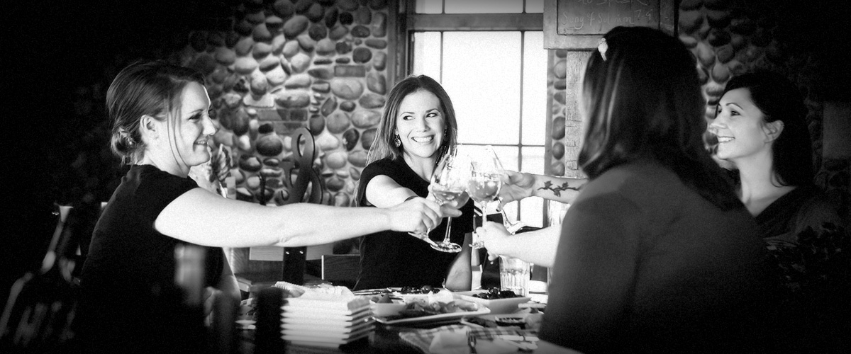 Ladies Toasting in 2Hawk Vineyard and Winery Tasting Room (Grayscale)