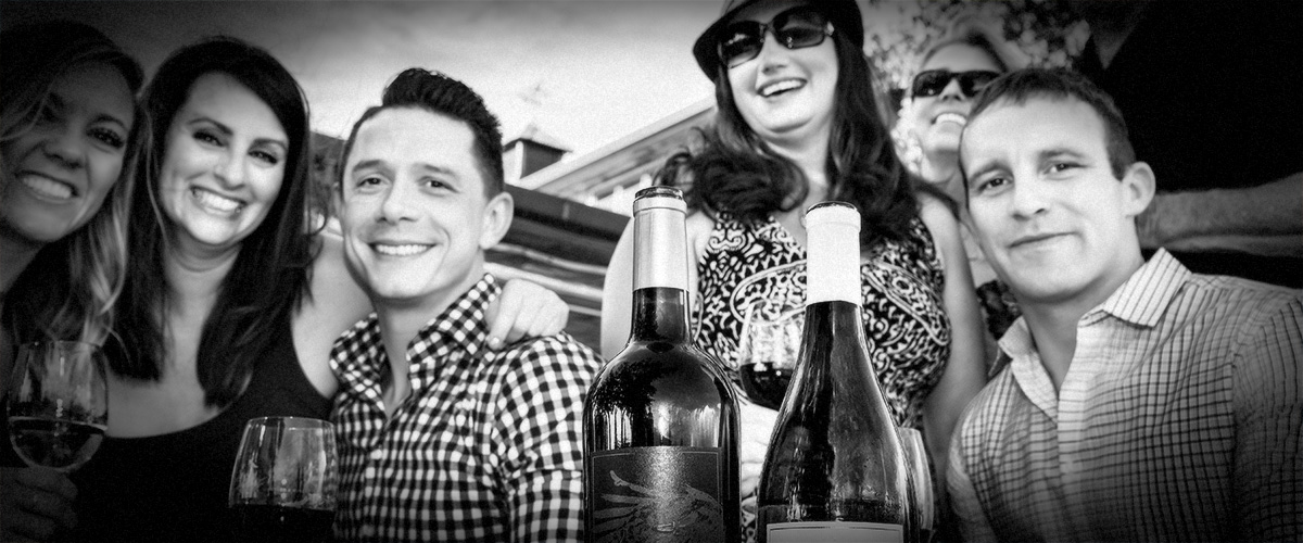 Friends Wine-Tasting Outdoors at 2Hawk Vineyard and Winery (Grayscale)