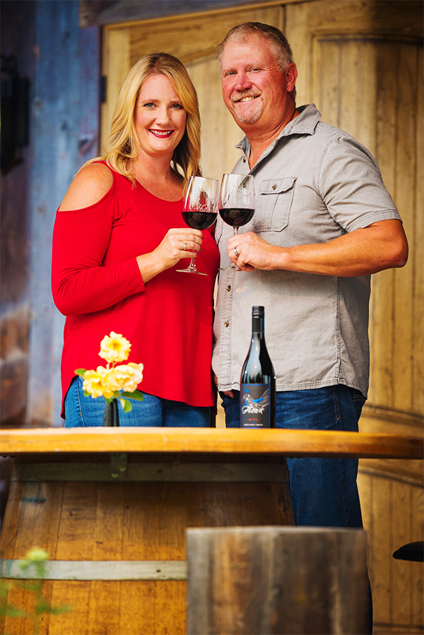 2Hawk Vineyard and Winery Owners Jen and Ross Allen with 911 Red Blend Wine